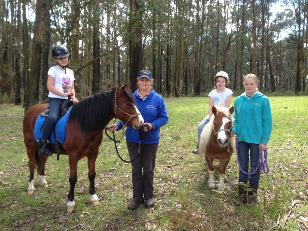 Having fun on a pony ride in the forest. 